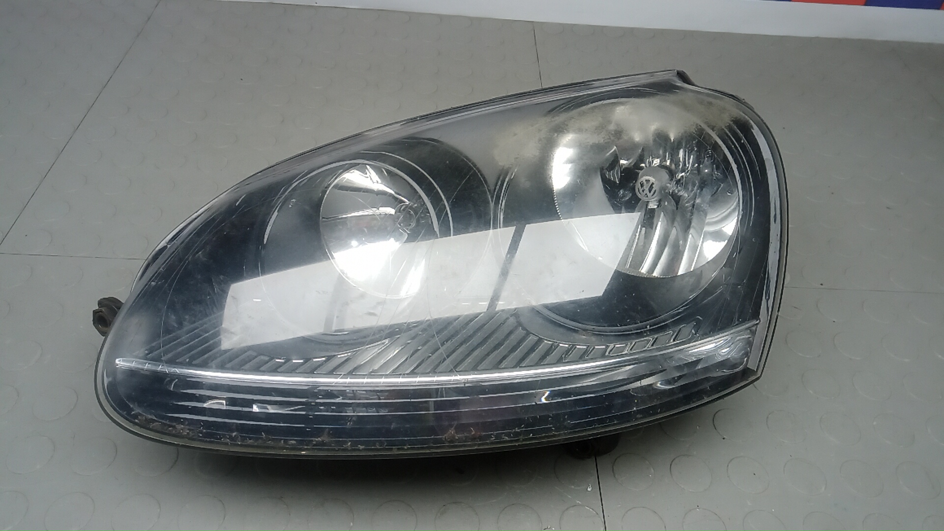 Фара левая Volkswagen Golf 5