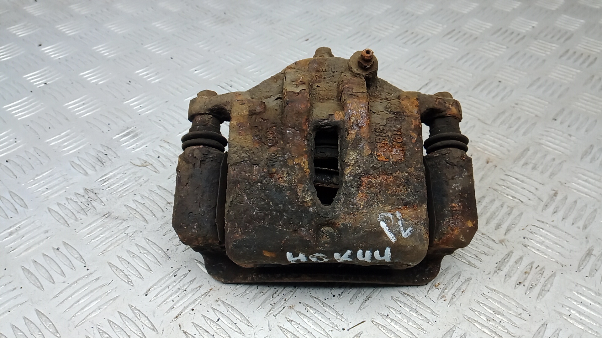 Суппорт тормозной передний левый Kia Sportage
