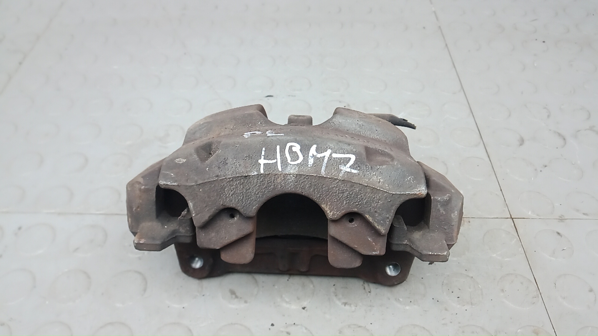 Суппорт тормозной передний левый Ford Focus 4